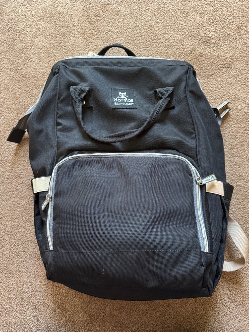 Black and tan backpack diaper/day bag